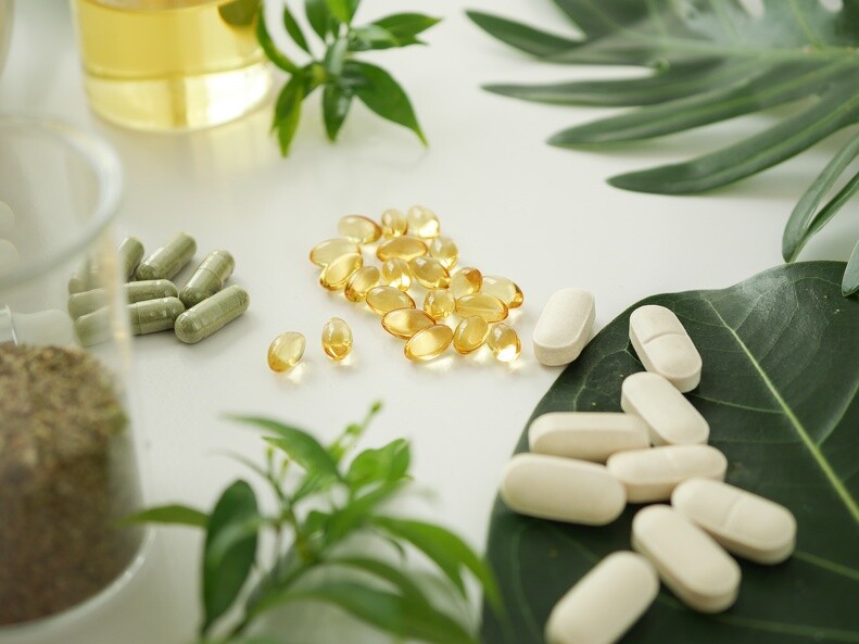 Check out our Health Care Lab+ Pills and capsules on a table with leaves for decoration